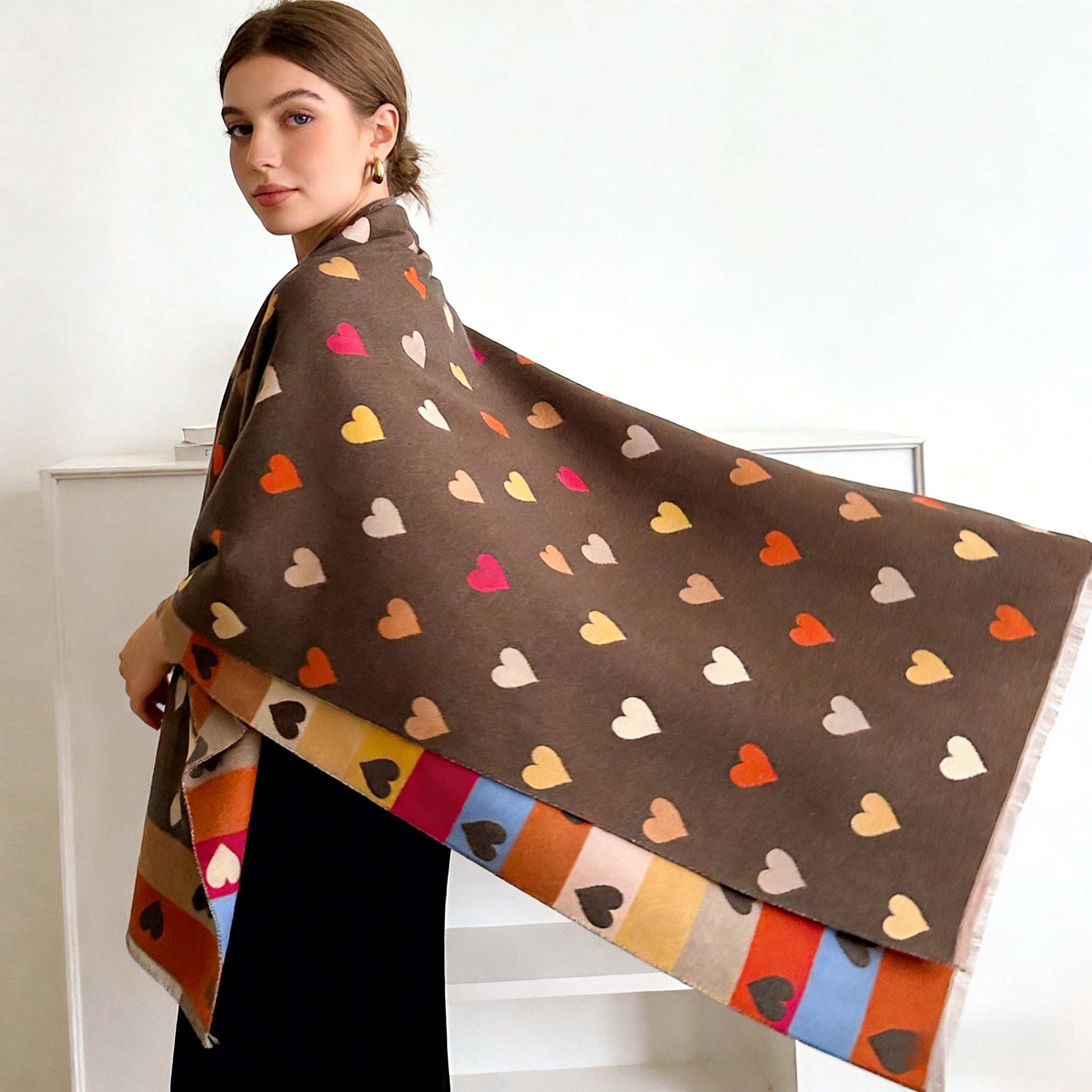 A Reversible Heart-Patterned Scarf for Women, Featuring a Cozy Blend of Beige, Brown, Red, Grey, And White with Black Hearts. Perfect for Parties, Dates, And Everyday Wear, This Stylish Winter Accessory Is Hand Washable